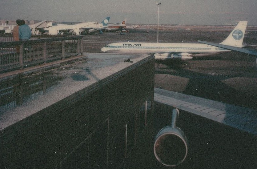 November 1978 Pan Am Boeing 707 tail number N433PA Clipper Glad Tidings taxis to Pan Am's WorldPort Terminal at New York JFK.  This picture was taken from the 4th floor roof top parking / observation deck of the WorldPort.